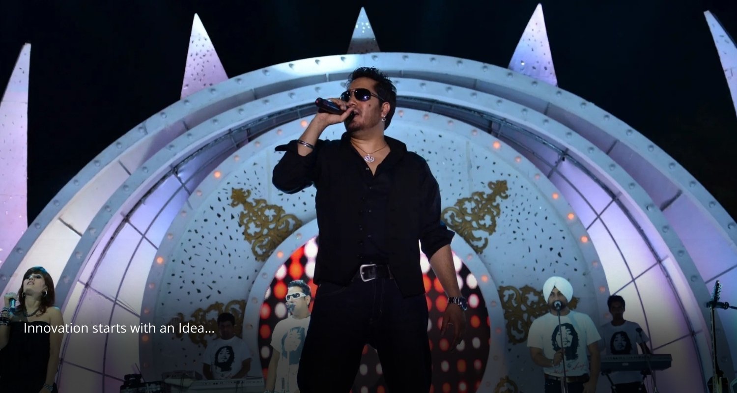 Elegant wedding setup with floral decorations and seating, white chairs and pastel flowers on tables, soft natural lighting, evening event with lights