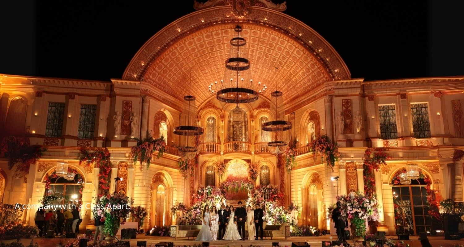 Elegant wedding setup with floral decorations and seating, white chairs and pastel flowers on tables, soft natural lighting, close up of floral centerpiece