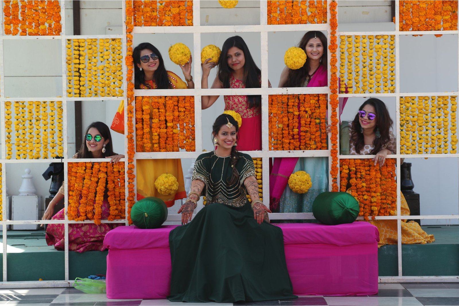 ITT event entrance with red and green carpet and pink lighting on white structure with ITT branding